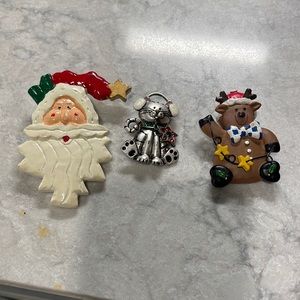 Three Christmas pins in excellent condition